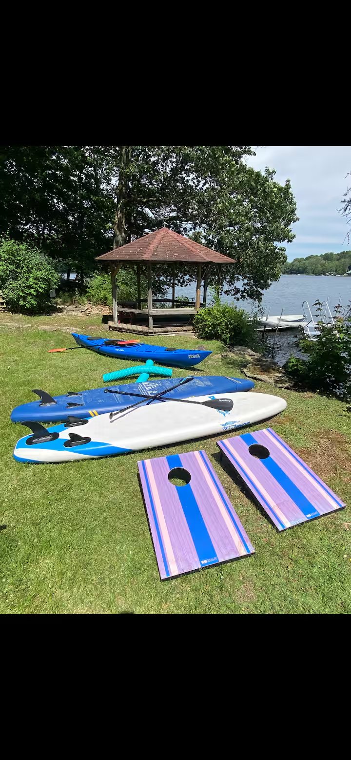 Private dock with gazebo, kayaks, paddle boards and cornhole on Shehawken Lake
