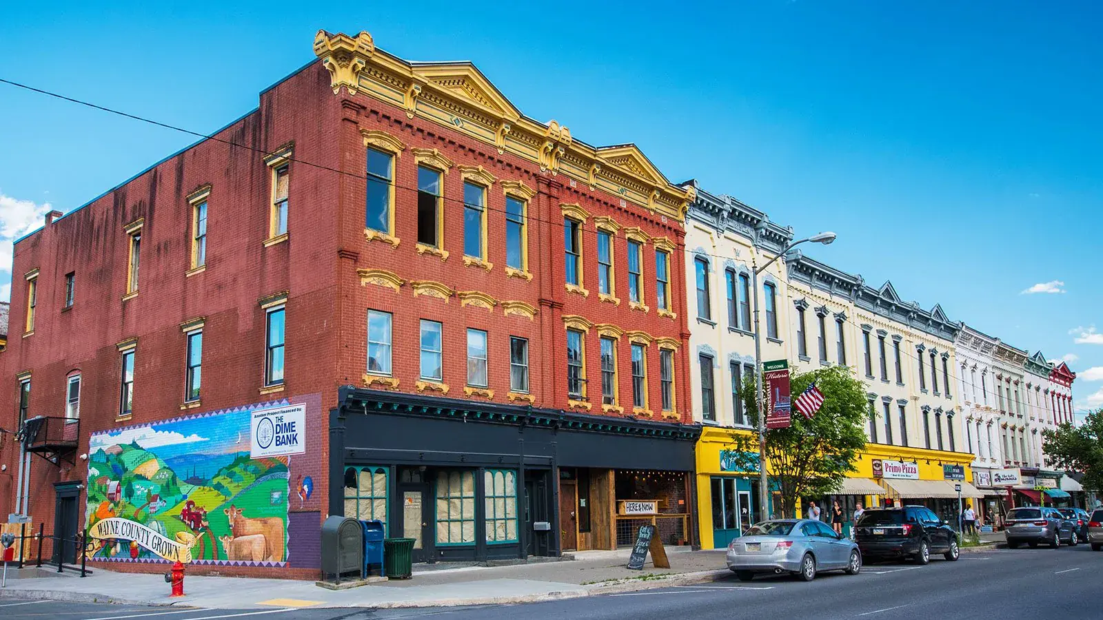 Honesdale's historic Main Street with the Wayne County Grown mural — restaurants and cafes 35 minutes south of Shehawken Lake